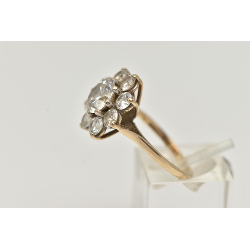 27 - A 9CT GOLD CUBIC ZIRCONIA CLUSTER RING, the circular cubic zirconia in claw settings, 9ct hallmark, ... 