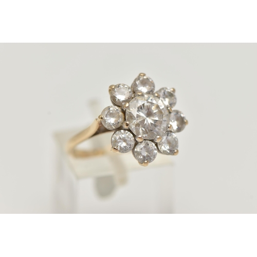 27 - A 9CT GOLD CUBIC ZIRCONIA CLUSTER RING, the circular cubic zirconia in claw settings, 9ct hallmark, ... 