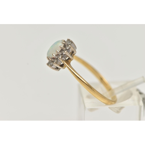 39 - AN OPAL AND DIAMOND CLUSTER RING, the central oval opal cabochon within a single cut diamond surroun... 