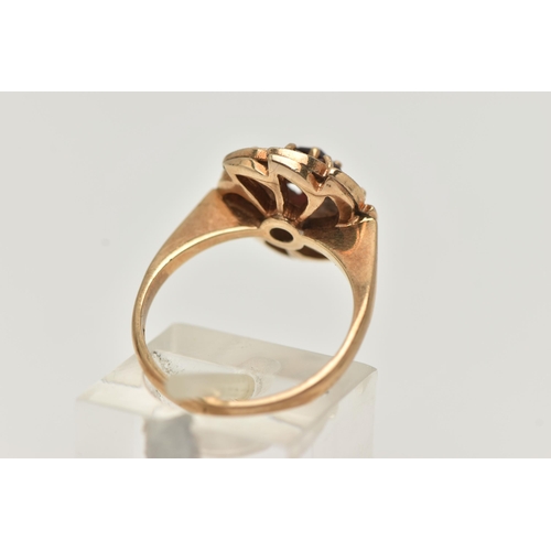 42 - A 9CT GOLD GARNET CLUSTER RING, designed as a circular garnet cluster, with leaf shape surround set ... 