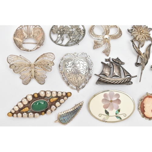 76 - A SELECTION OF SILVER AND WHITE METAL BROOCHES, to include a late Victorian silver brooch, an early ... 