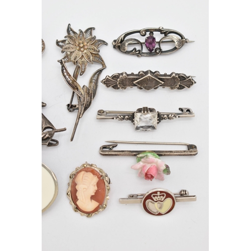 76 - A SELECTION OF SILVER AND WHITE METAL BROOCHES, to include a late Victorian silver brooch, an early ... 