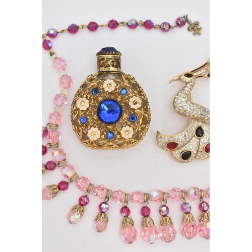 81 - A SMALL ASSORTMENT OF COSTUME JEWELLERY, to include a pink beaded necklace, two bird brooches, toget... 