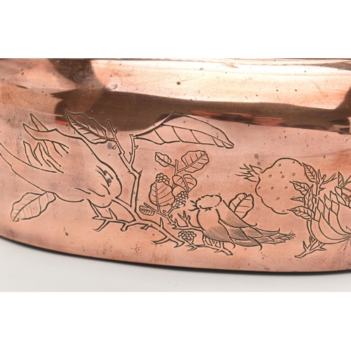 100 - AN ORIENTAL COPPER AND BRASS HAND WARMER, engraved design to one side, pierced cover and fitted with... 