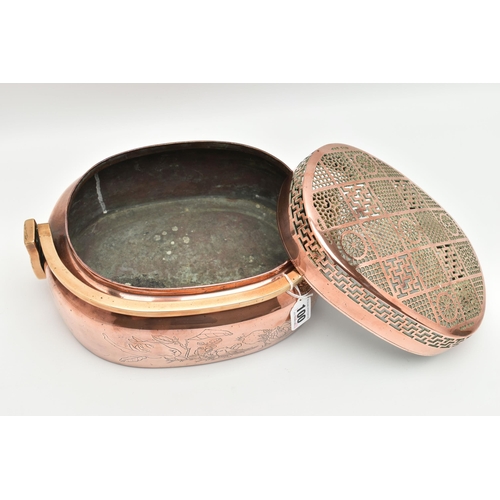 100 - AN ORIENTAL COPPER AND BRASS HAND WARMER, engraved design to one side, pierced cover and fitted with... 