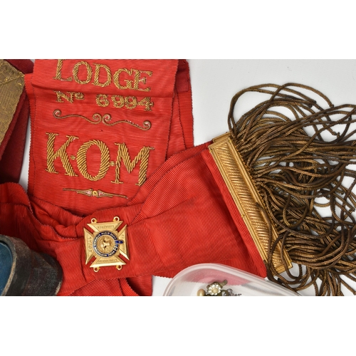 112 - A BOX OF ASSORTED MASONIC ITEMS, to include an apron, a sash and a pair of gauntlets, also including... 