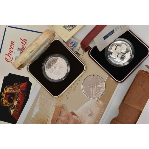 126 - A CARDBOARD FRUIT BOX CONTAINING CARDED COIN PROOF COIN YEAR SETS AND LOOSE COINS, to include, a box... 