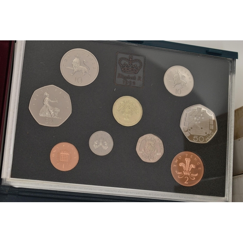 127 - A LARGE BOX CONTAINING ROYAL MINT PROOF YEAR SETS, to include proof sets from 1983 - 2003, with 1997... 