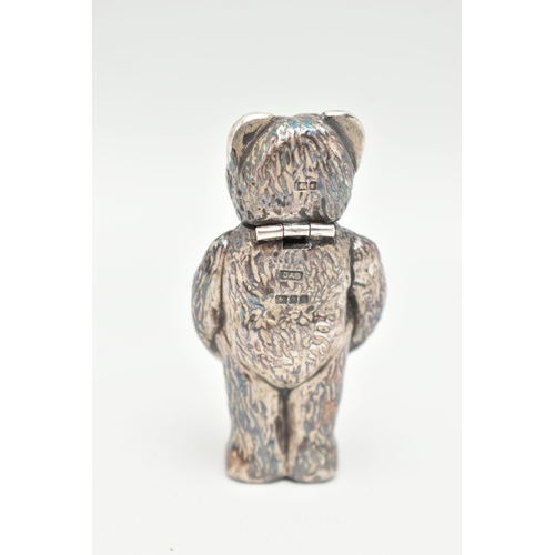 88 - A SILVER NOVELTY VESTA CASE, in the form of a textured teddy bear with glass eyes, the head is a hin... 