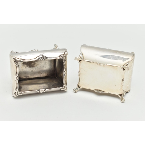 90 - A PAIR OF GEORGE V SILVER SALTS, each of a rectangular form with swag detail to the rim, raised on f... 