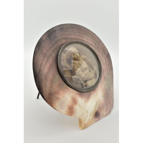 97 - AN EARLY 20TH CENTURY, BLACK LIP OYSTER MOTHER OF PEARL AND SILVER PHOTO FRAME, shell with a central... 