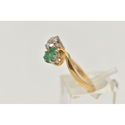 141 - A DIAMOND AND EMERALD TWO STONE RING, an old cut diamond, approximate total diamond weight 0.65ct, a... 