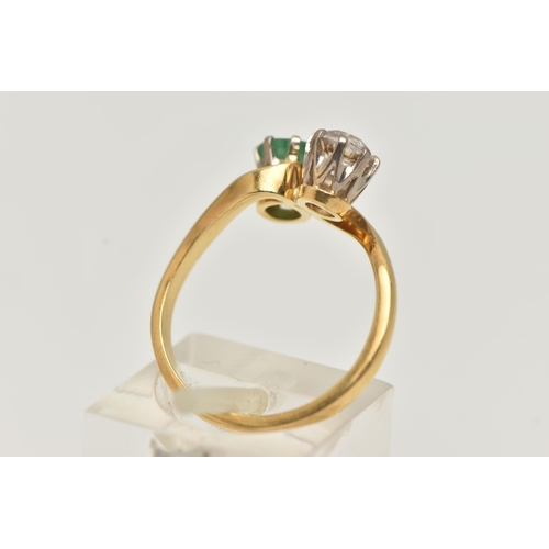 141 - A DIAMOND AND EMERALD TWO STONE RING, an old cut diamond, approximate total diamond weight 0.65ct, a... 