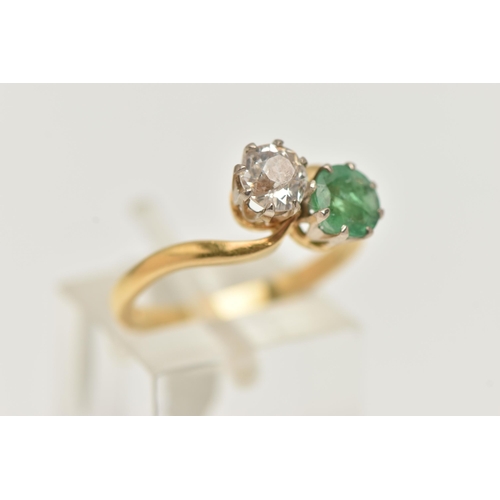 141 - A DIAMOND AND EMERALD TWO STONE RING, an old cut diamond, approximate total diamond weight 0.65ct, a... 