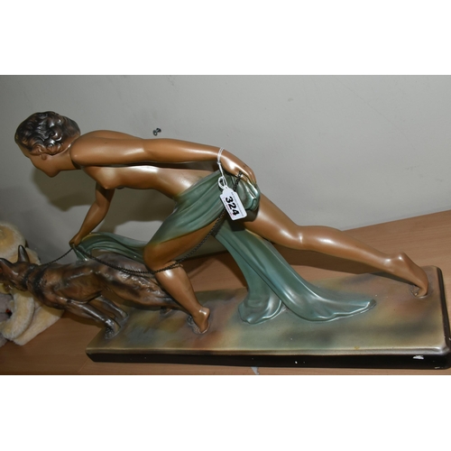 324 - A LARGE ART DECO PATINATED PLASTER SCULPTURE, a figure of a nude female and Alsatian dog, width 70cm... 