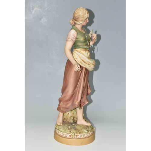 341 - A ROYAL DUX FIGURE, comprising a young woman gathering seaweed, with applied pink triangular Royal D... 