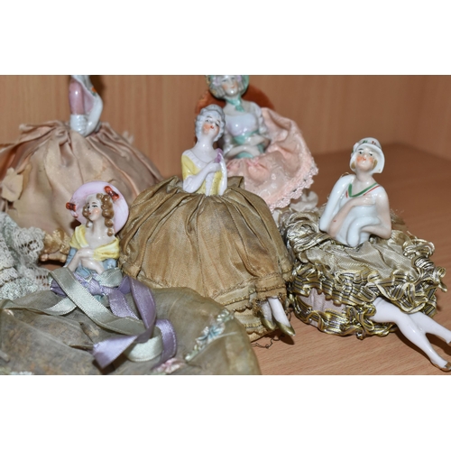 343 - A GROUP OF LATE 19TH AND EARLY 20TH CENTURY PORCELAIN PIN DOLLS, nine pin cushion dolls and one lave... 