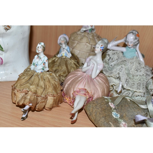 343 - A GROUP OF LATE 19TH AND EARLY 20TH CENTURY PORCELAIN PIN DOLLS, nine pin cushion dolls and one lave... 