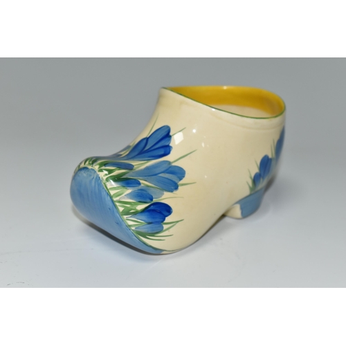 357 - A CLARICE CLIFF SMALL SABOT/CLOG, in Blue Crocus pattern, painted with the blue flowers on the toe a... 