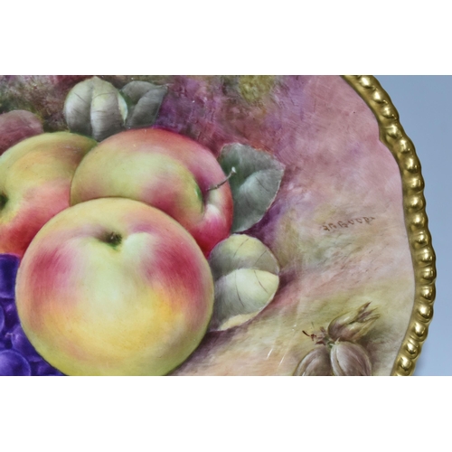 363 - A COALPORT HAND PAINTED CABINET PLATE, with gilt rim, hand painted with apples, grapes and hazel nut... 