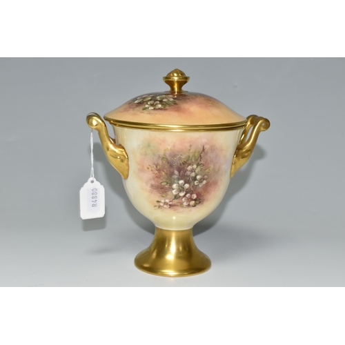 364 - A COALPORT COVERED VASE, the gilt footed vase with twin gilt handles, hand painted with apples, blac... 