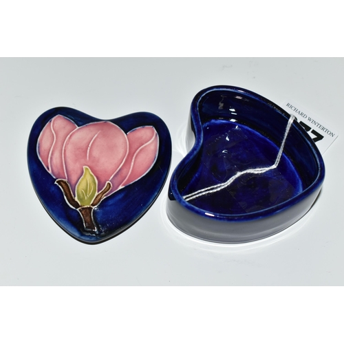 377 - A MOORCROFT POTTERY 'MAGNOLIA' PATTERN TRINKET BOX, heart shaped box and cover, tube lined with a pi... 