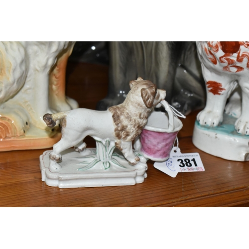 381 - A GROUP OF 19TH AND EARLY 20TH CENTURY CERAMIC CATS AND DOGS, comprising a late 19th century bisque ... 