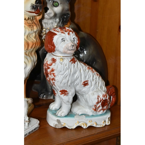 381 - A GROUP OF 19TH AND EARLY 20TH CENTURY CERAMIC CATS AND DOGS, comprising a late 19th century bisque ... 