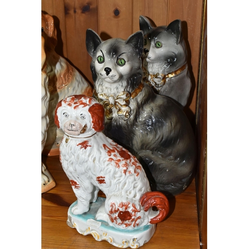 381 - A GROUP OF 19TH AND EARLY 20TH CENTURY CERAMIC CATS AND DOGS, comprising a late 19th century bisque ... 