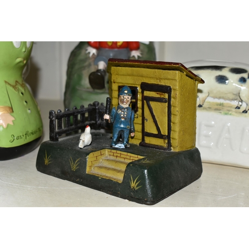 387 - A COLLECTION OF MONEY BOXES, including a vintage plastic Noddy Money box, a reproduction cast iron m... 