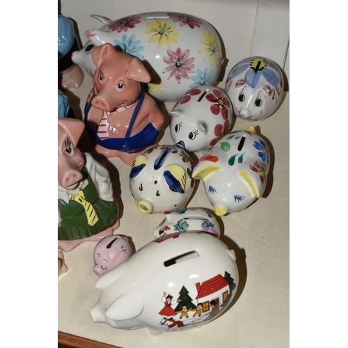 397 - NINE WADE NATWEST PIG MONEY BOXES AND EIGHT OTHER CERAMIC PIGGY BANKS, the NatWest comprising two Wo... 