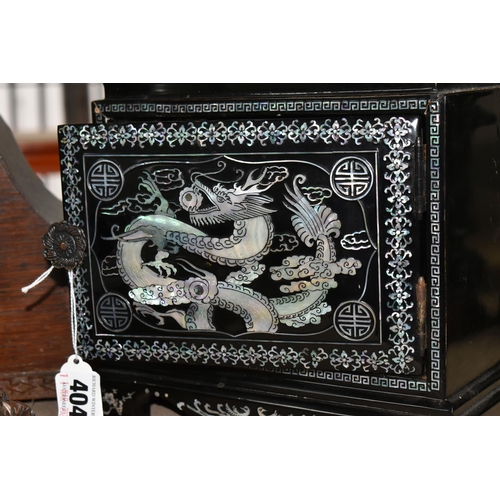 404 - A GROUP OF CLOCKS AND AN ORIENTAL STYLE JEWELLERY BOX, black lacquered with three drawers and mother... 