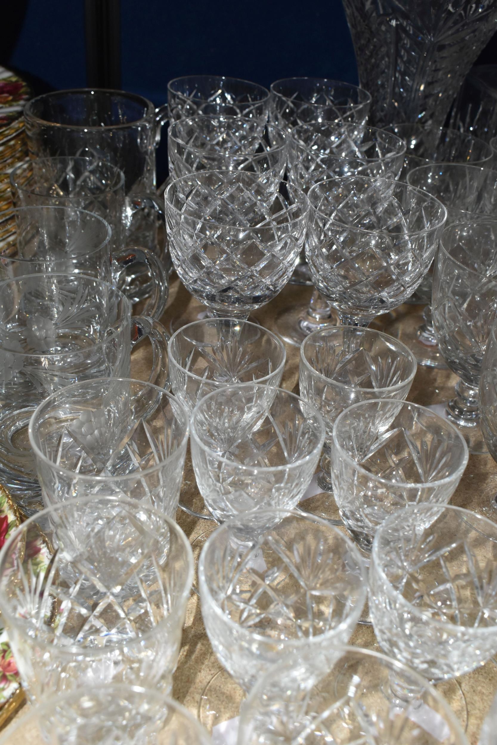 A LARGE QUANTITY OF CUT CRYSTAL AND GLASSWARE, comprising a set of six