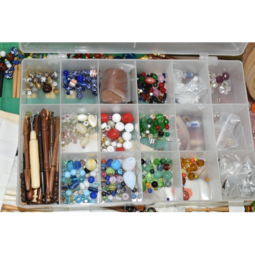 426 - TWO BOXES OF LACE MAKING BOBBINS AND CUSHIONS, to include a large collection of lace making bobbins ... 