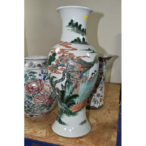 438 - A 19TH CENTURY CHINESE FAMILLE VERT BALUSTER VASE, enamelled with a continuous scene of figures in b... 