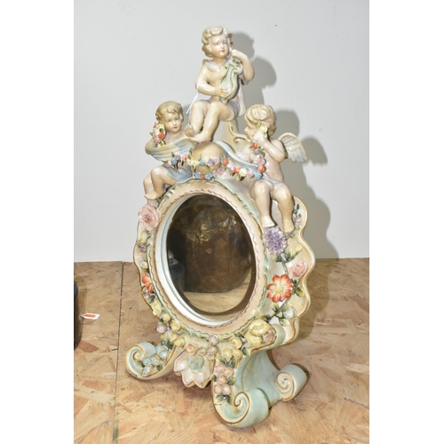 440 - AN EARLY 20TH CENTURY SITZENDORF PORCELAIN FLORAL ENCRUSTED AND FIGURAL MIRROR, modelled with three ... 