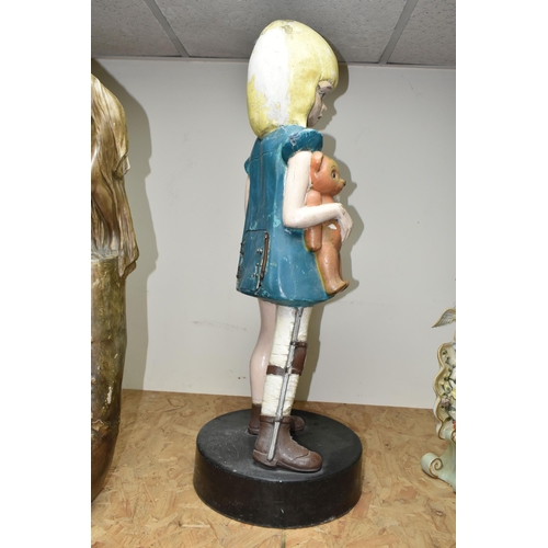 441 - A VINTAGE FIBREGLASS DISABILITY CHARITY COLLECTION BOX IN THE FORM OF A GIRL HOLDING A TEDDY WITH HE... 