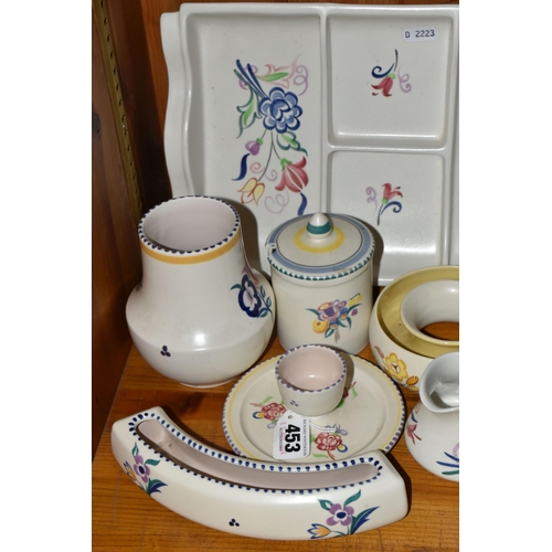 453 - EIGHT PIECES OF POOLE POTTERY, all with floral decoration, including an hors oeuvres dish, an eggcup... 