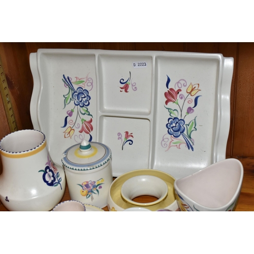 453 - EIGHT PIECES OF POOLE POTTERY, all with floral decoration, including an hors oeuvres dish, an eggcup... 