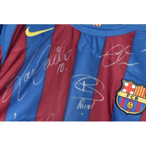 478 - A SIGNED BARCELONA HOME REPLICA FOOTBALL SHIRT, signed by Ronaldinho, Eto'o, Puyol, Deco, Valdes, La... 