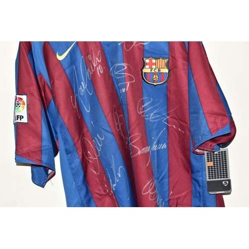 478 - A SIGNED BARCELONA HOME REPLICA FOOTBALL SHIRT, signed by Ronaldinho, Eto'o, Puyol, Deco, Valdes, La... 