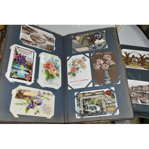 480 - TWO ALBUMS OF POSTCARDS containing approximately 564 early 20th century cards (with exceptions) and ... 