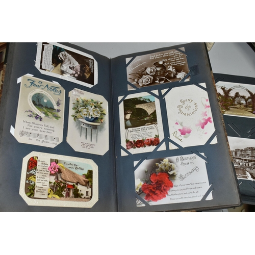 480 - TWO ALBUMS OF POSTCARDS containing approximately 564 early 20th century cards (with exceptions) and ... 