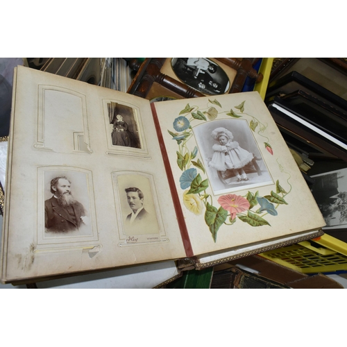 490 - THREE BOXES OF EARLY 20TH CENTURY EPHEMERA containing eight albums of postcards and personal photogr... 