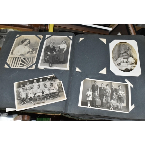 490 - THREE BOXES OF EARLY 20TH CENTURY EPHEMERA containing eight albums of postcards and personal photogr... 