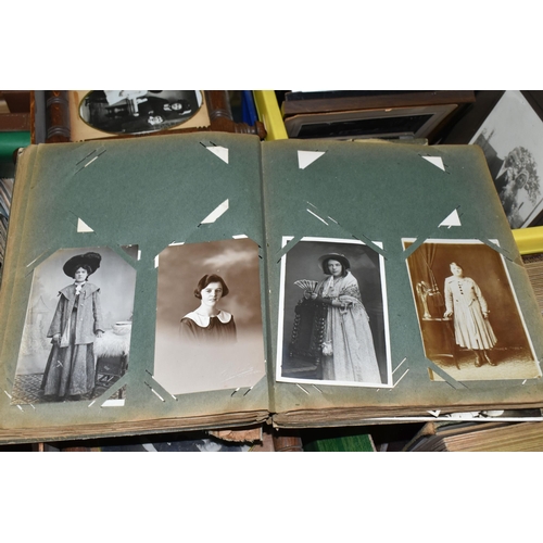 490 - THREE BOXES OF EARLY 20TH CENTURY EPHEMERA containing eight albums of postcards and personal photogr... 