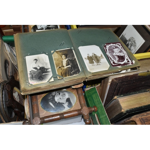 490 - THREE BOXES OF EARLY 20TH CENTURY EPHEMERA containing eight albums of postcards and personal photogr... 