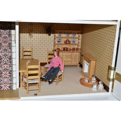 510 - A MODERN FOUR STOREY DOLLS HOUSE OF GEORGIAN STYLE WITH A QUANTITY OF ACCESSORIES, the top three sto... 