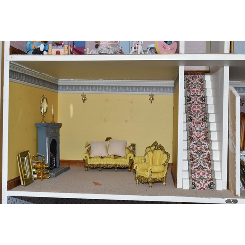 510 - A MODERN FOUR STOREY DOLLS HOUSE OF GEORGIAN STYLE WITH A QUANTITY OF ACCESSORIES, the top three sto... 