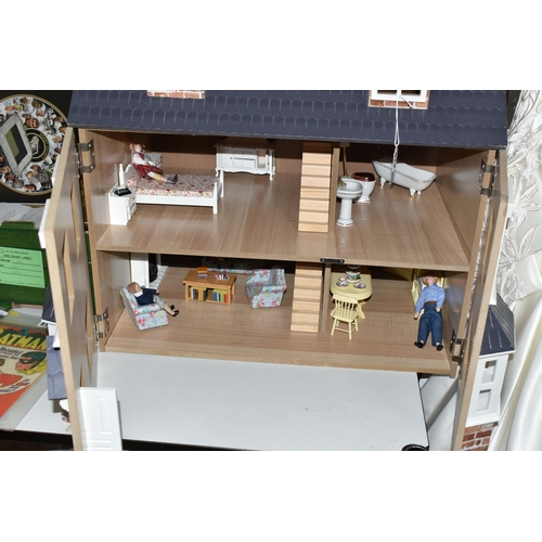 513 - A MODERN THREE STOREY DOLLS HOUSE OF LATE VICTORIAN STYLE, with papered red brick effect exterior, h... 